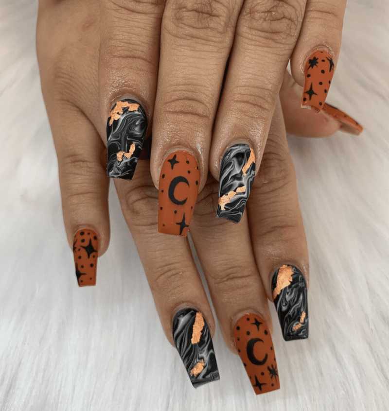 Burnt Orange Nails With Celestial Designs