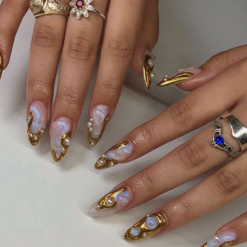 Artistic Nails Tips and Golden Pearls